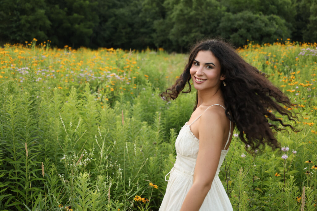 Grace in a field of yellow flowers