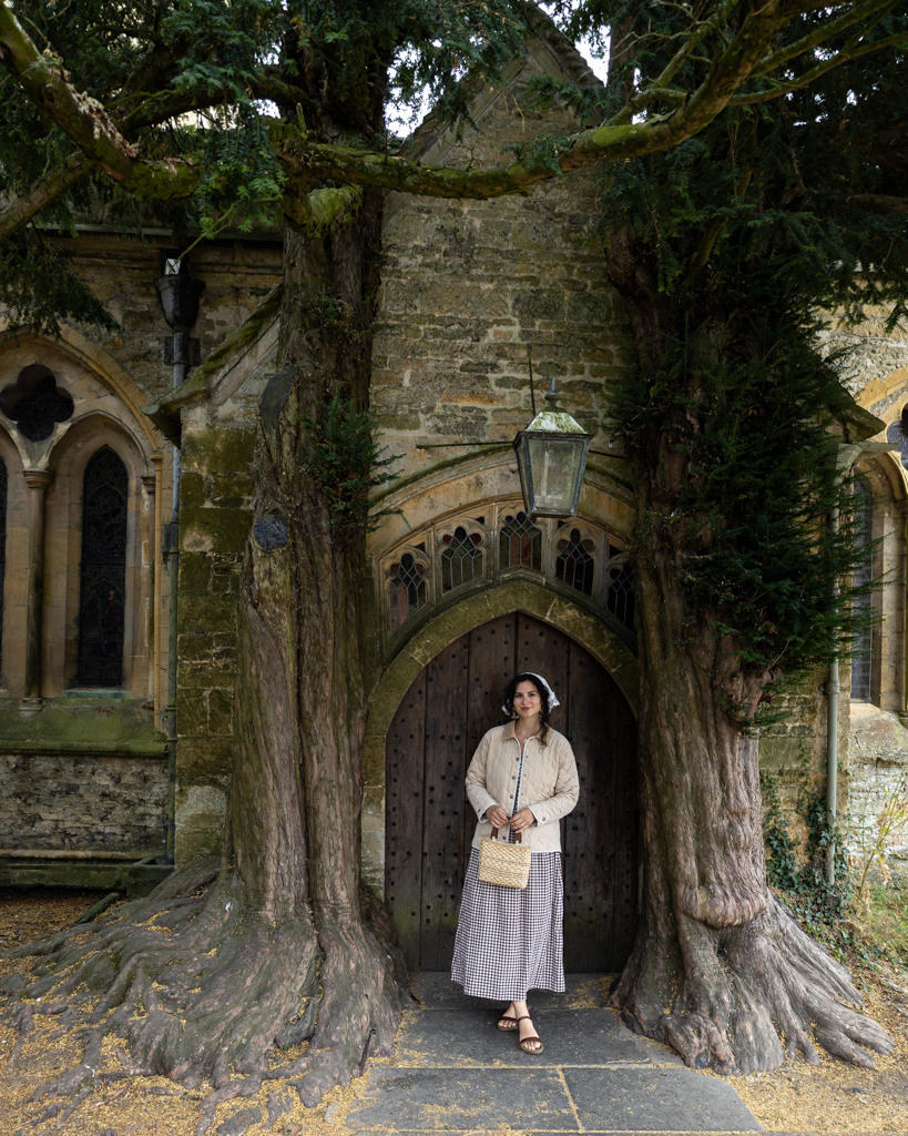 girl standing in front of old church door