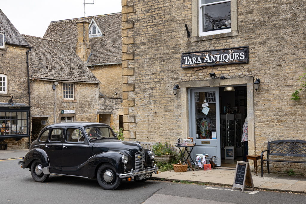 Antique storefront with old car