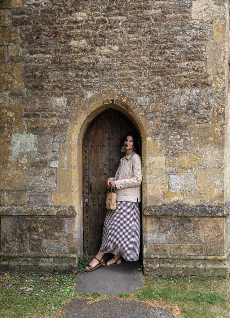 Person standing in an old church door